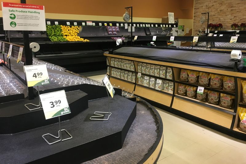 Produce shelves lie empty at the Save-On-Foods grocery store in