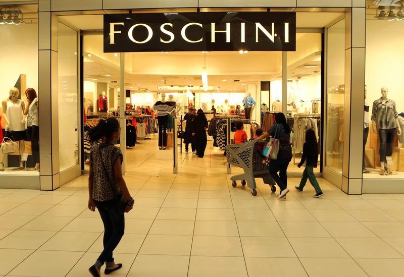 FILE PHOTO: A shopper walks past a Foschini store at