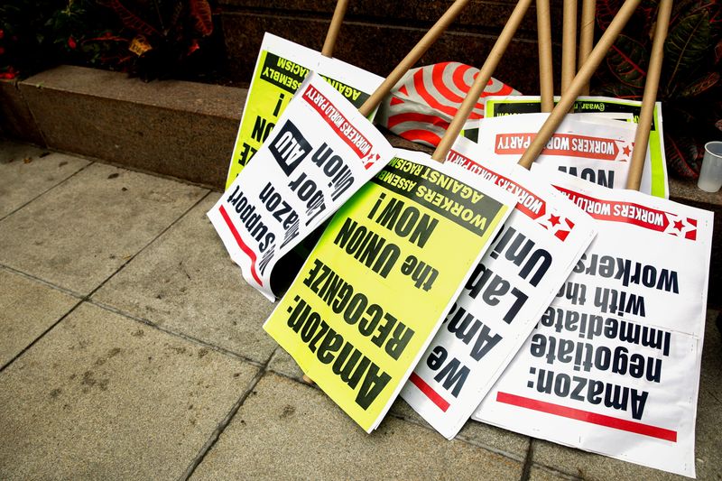 FILE PHOTO: Signs are stacked for Amazon workers before they