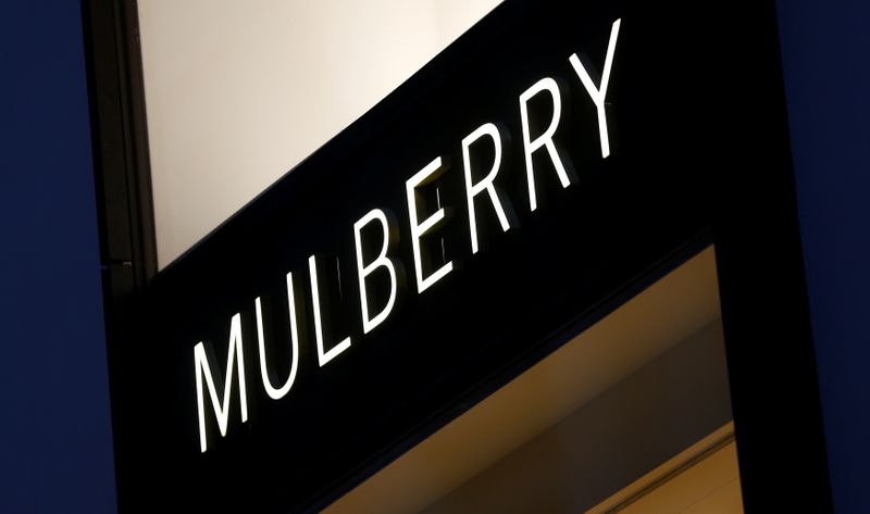 A company logo is pictured outside a Mulberry store in