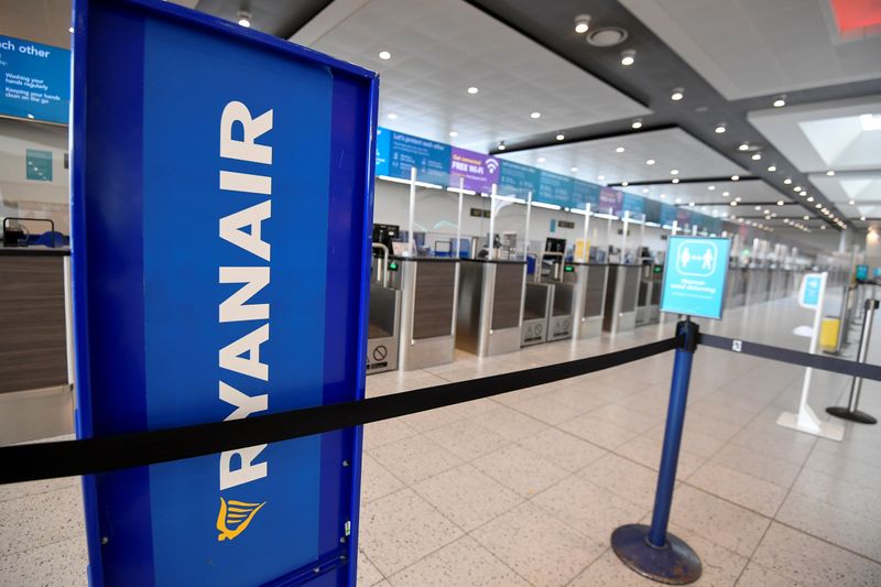 Ryanair sign is seen at the check-in area at Gatwick