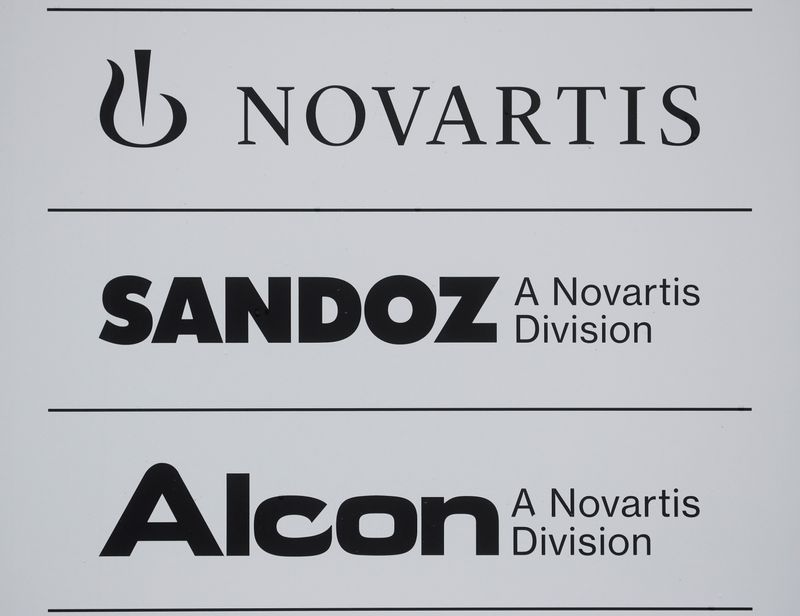 FILE PHOTO: Logos of Swiss drugmaker Novartis and its divisions