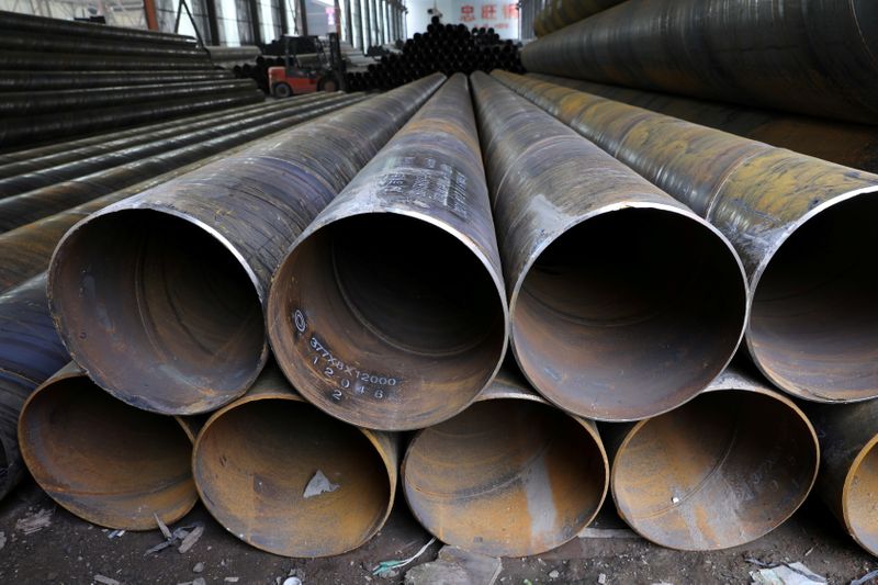 FILE PHOTO: Steel pipes are seen stacked at an industrial
