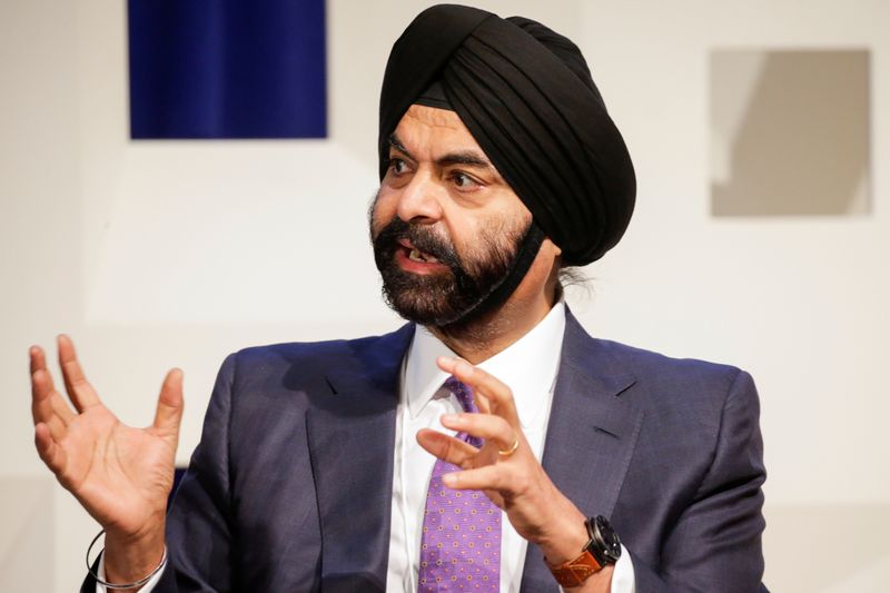 Mastercard President and CEO Banga speaks to attendees during the