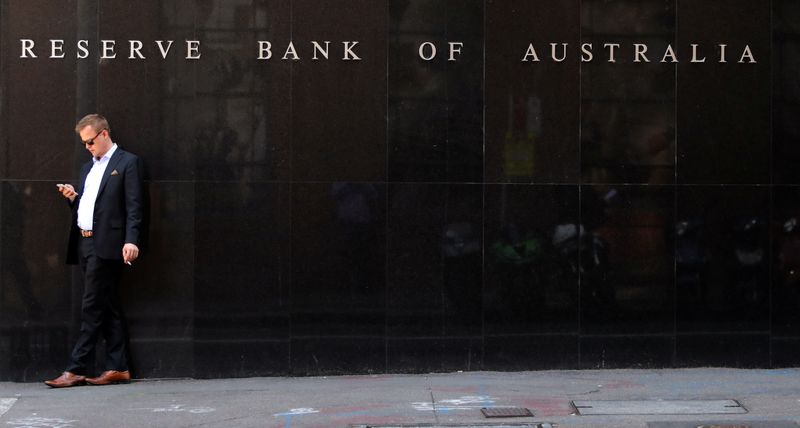 A man smokes next to the Reserve Bank of Australia