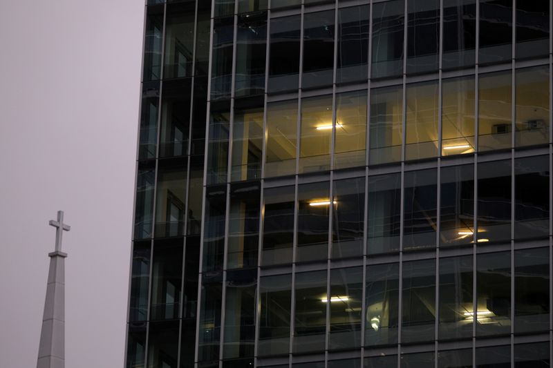 FILE PHOTO: Office lights are illuminated in a high rise