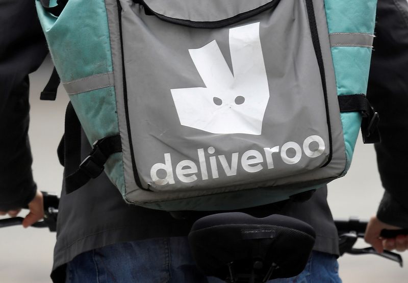FILE PHOTO: FILE PHOTO: A Deliveroo delivery rider cycles in