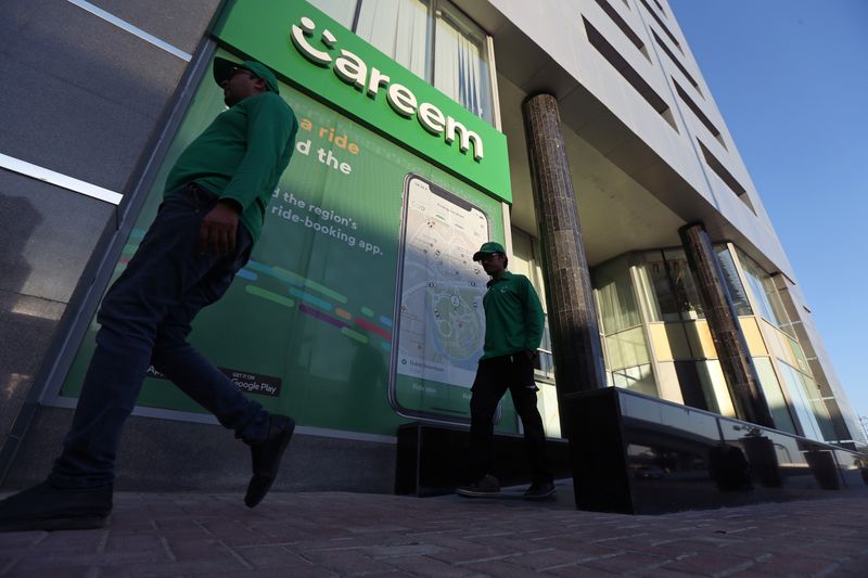 Careem employees walk past the company headquarters in Dubai.