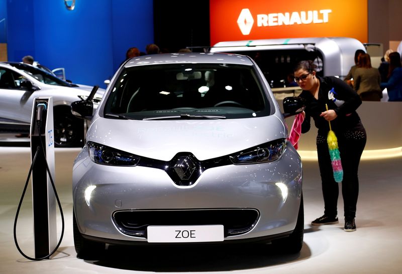 FILE PHOTO: A worker cleans a Renault Zoe electric car