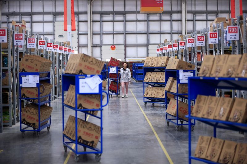 FILE PHOTO: An employee works at a Tmall logistic centre