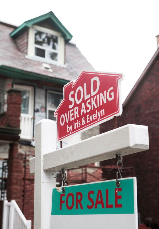 FILE PHOTO: A “Sold over asking” sign is on display