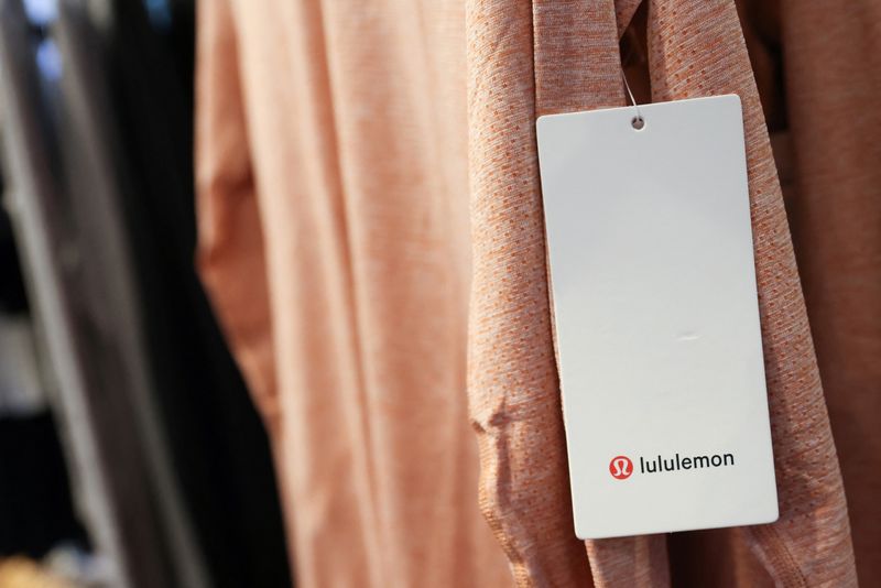 A tag is seen on clothing in a Lululemon Athletica