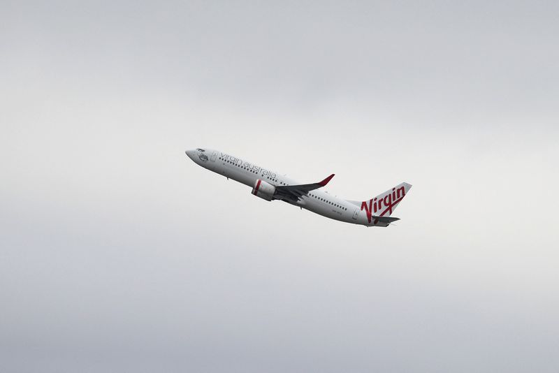A Virgin Australia Airlines plane takes off from Sydney Airport