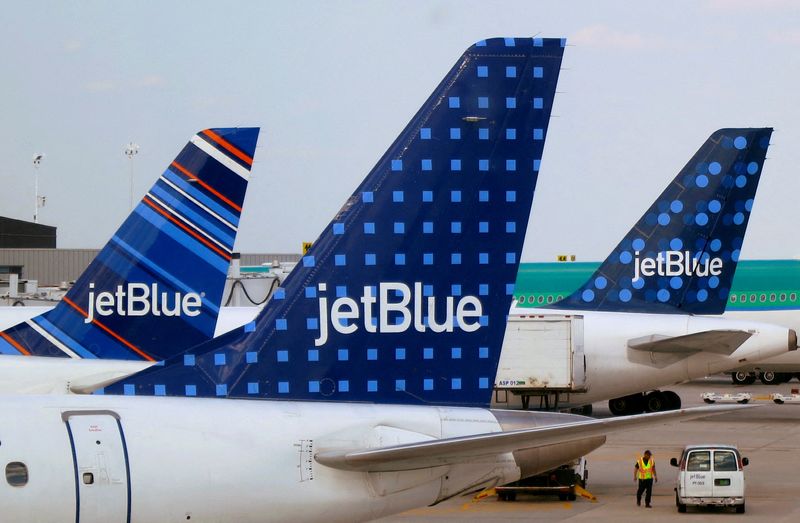 FILE PHOTO: JetBlue Airways aircraft are pictured at departure gates
