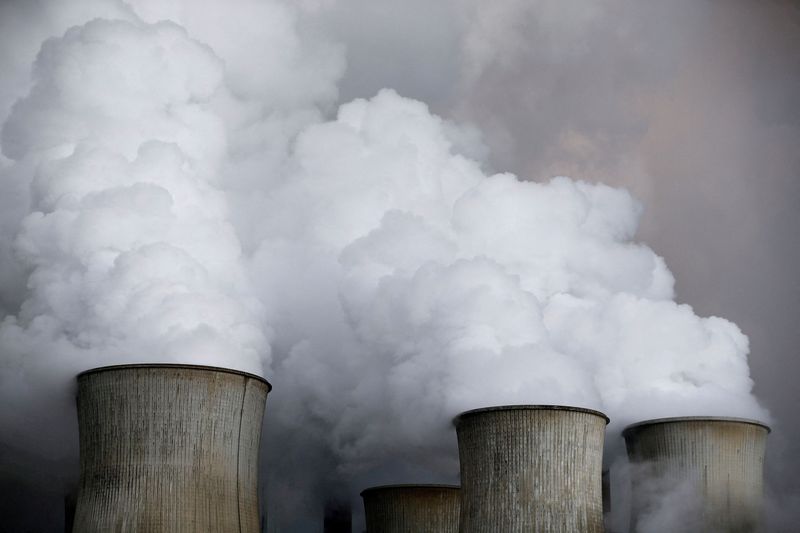 Steam rises from the cooling towers of the coal power