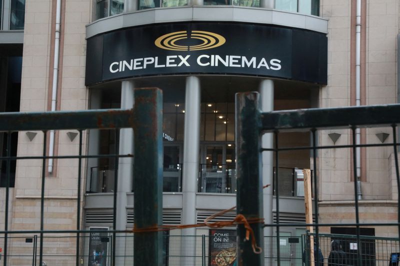 A Cineplex movie theatre sign is seen over a construction