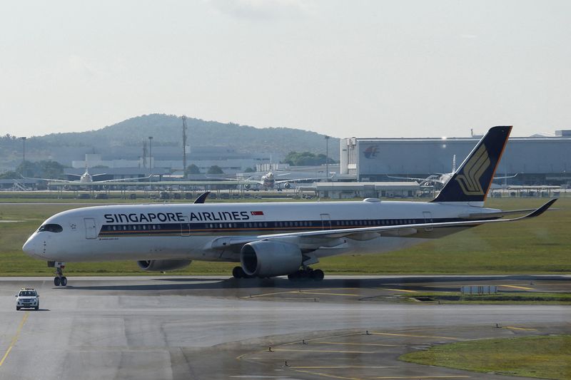 FILE PHOTO: Singapore Airlines plane lands at Kuala Lumpur International