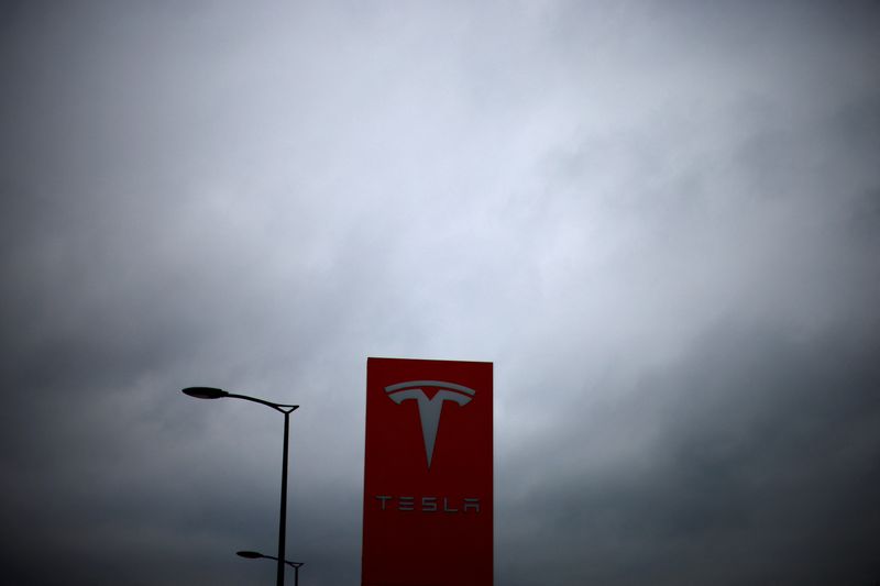 Tesla logo at a dealership in Chambourcy