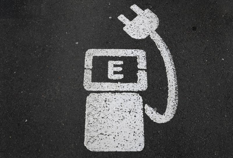 A battery charger sign for electric cars is painted on