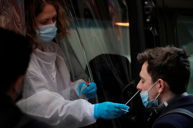 FILE PHOTO: A man takes a coronavirus disease (COVID-19) test