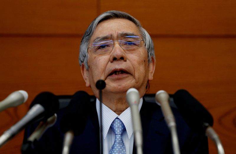 FILE PHOTO: Bank of Japan (BOJ) Governor Haruhiko Kuroda attends