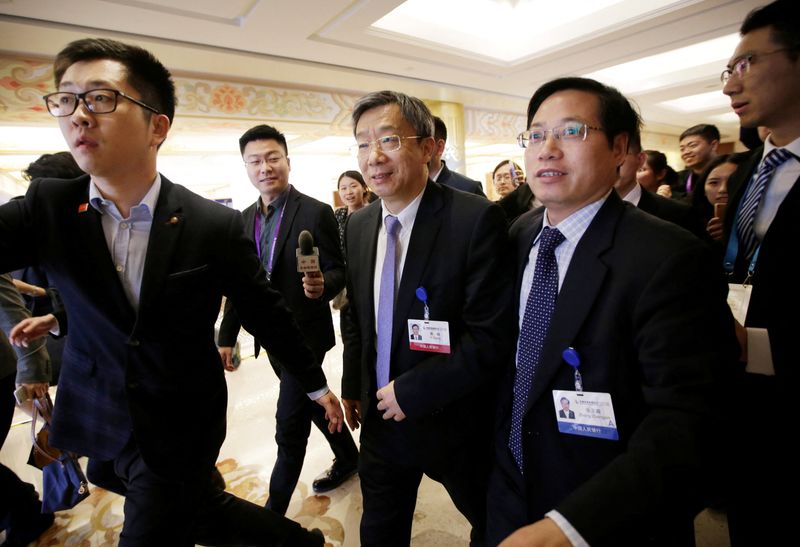 China’s new Central Bank Governor Yi Gang leaves after a