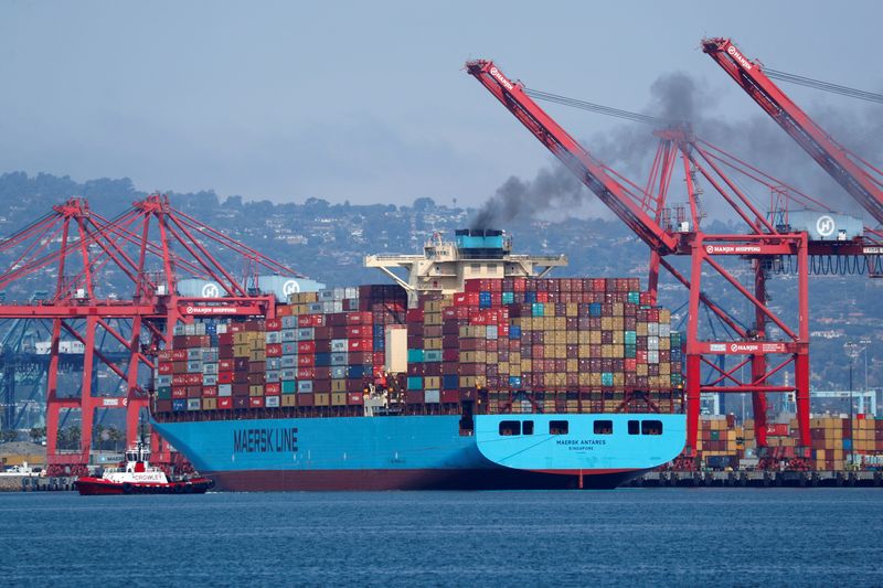 A Maersk Line container ship prepares to depart port in