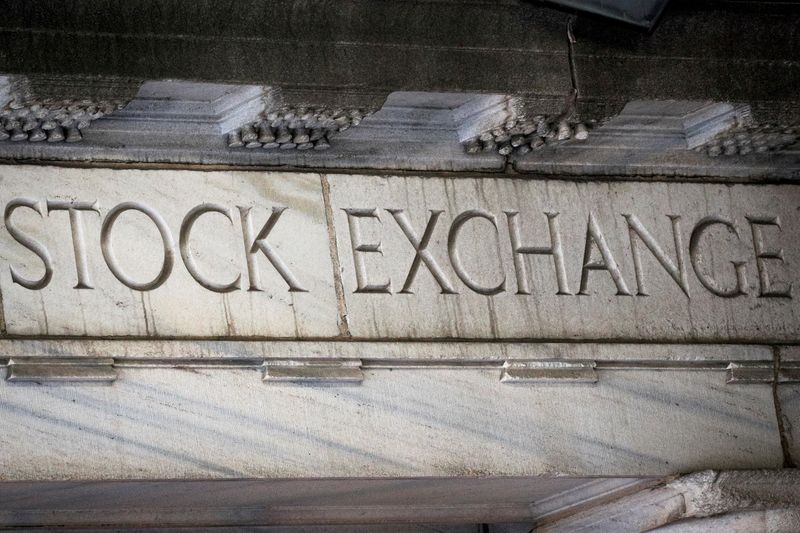 FILE PHOTO: An entrance to the NYSE on Wall Street