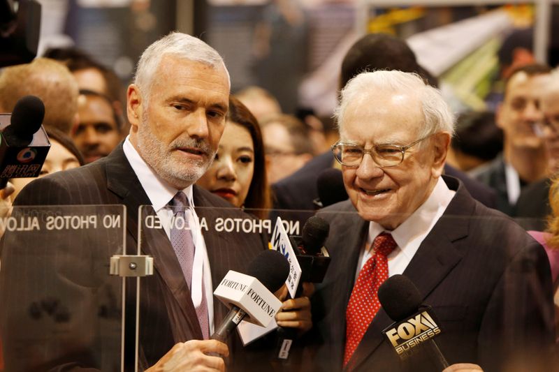FILE PHOTO: Warren Buffett talks with Mark Donegan CEO of