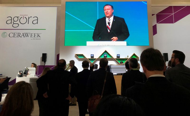 FILE PHOTO: Attendees at IHS Markit’s CERAWeek conference watch the