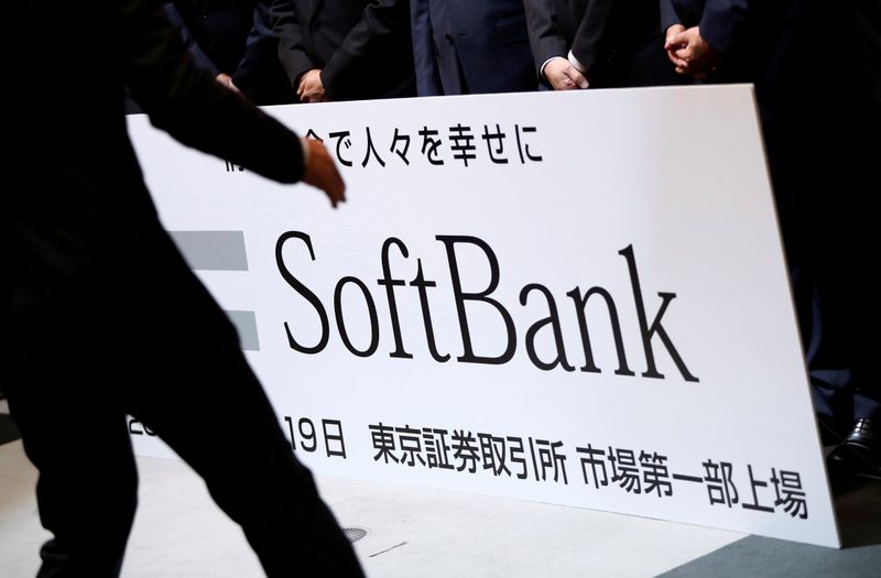 FILE PHOTO: SoftBank Corp. placard is prepared during a ceremony