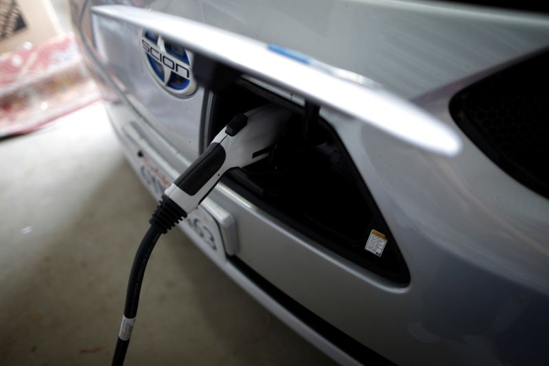 FILE PHOTO: A computer science professor’s electric car is plugged