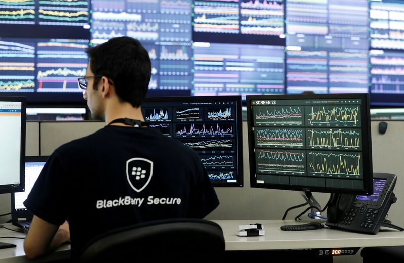 FILE PHOTO: An employee works at his desk at Blackberry’s