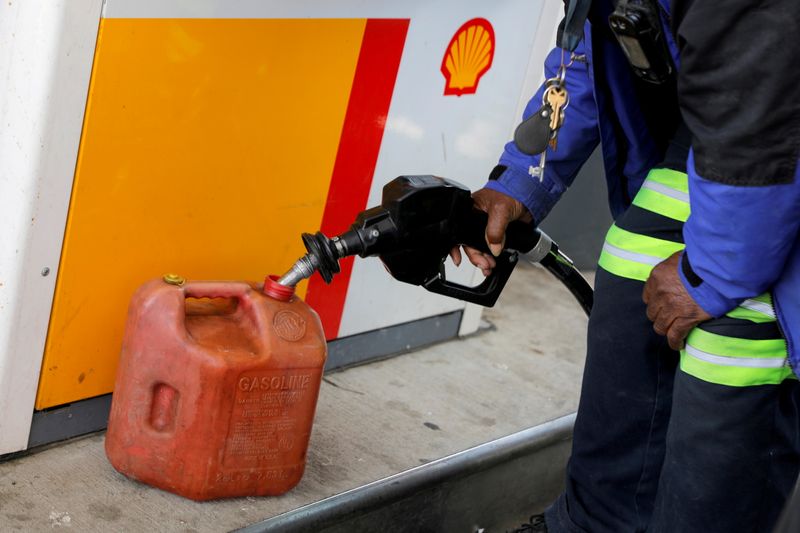 FILE PHOTO: A person fills a fuel container at a
