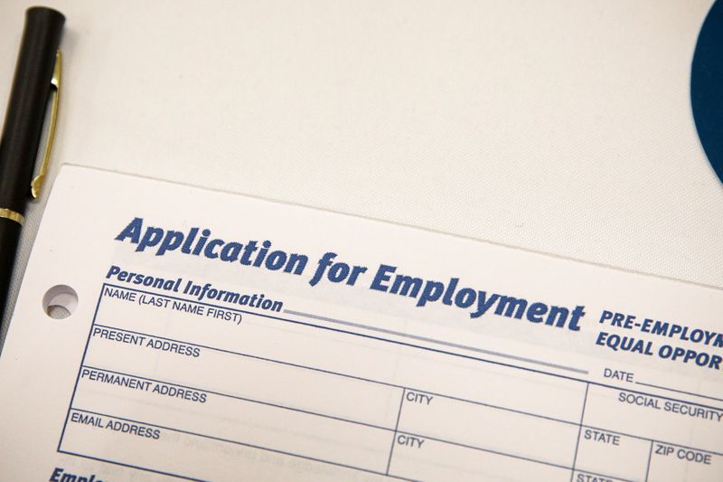 An employment application form is displayed during a restaurant job