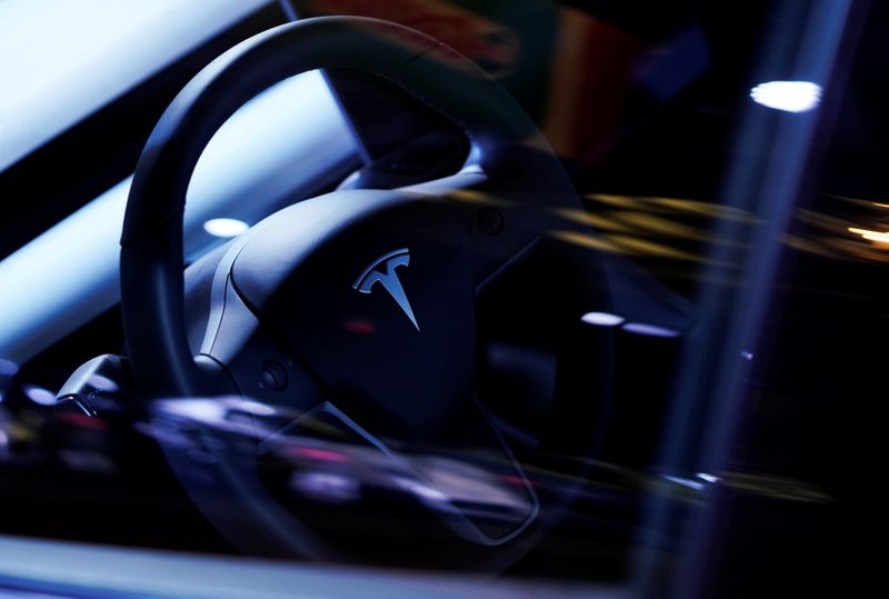 A Tesla Model S steering wheel is on display at