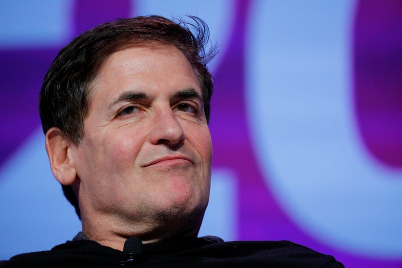 Businessman Mark Cuban listens as he is introduced at the