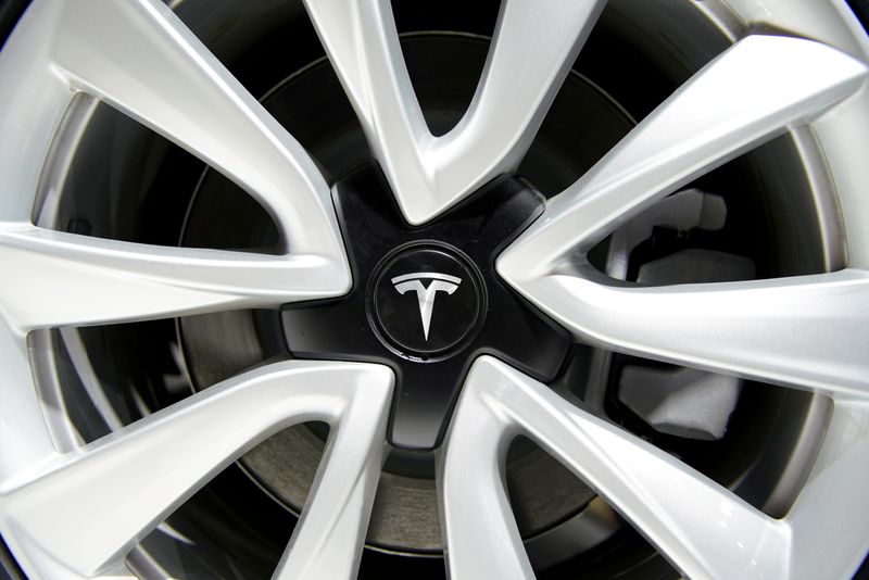 FILE PHOTO: Tesla logo is seen on a wheel rim