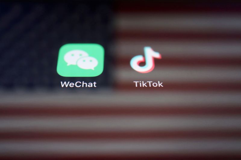 FILE PHOTO: Illustration picture of U.S. flag with WeChat and