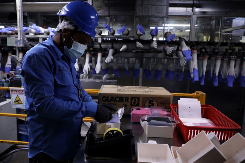 FILE PHOTO: A worker works at a production line in