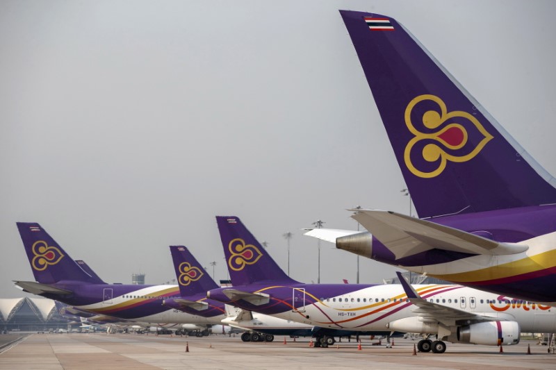 FILE PHOTO: Thai Airways aircraft are parked on the tarmac