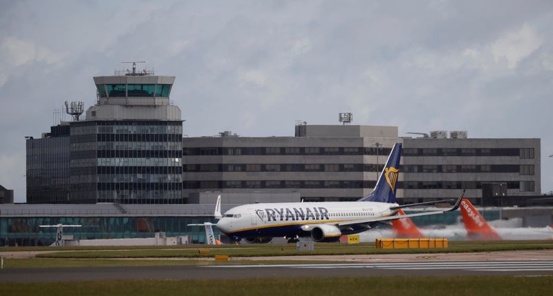 A Ryanair plane takes off from Manchester Airport as the
