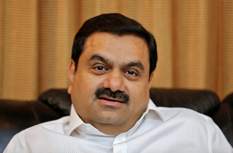 FILE PHOTO: Indian billionaire Adani speaks during an interview with