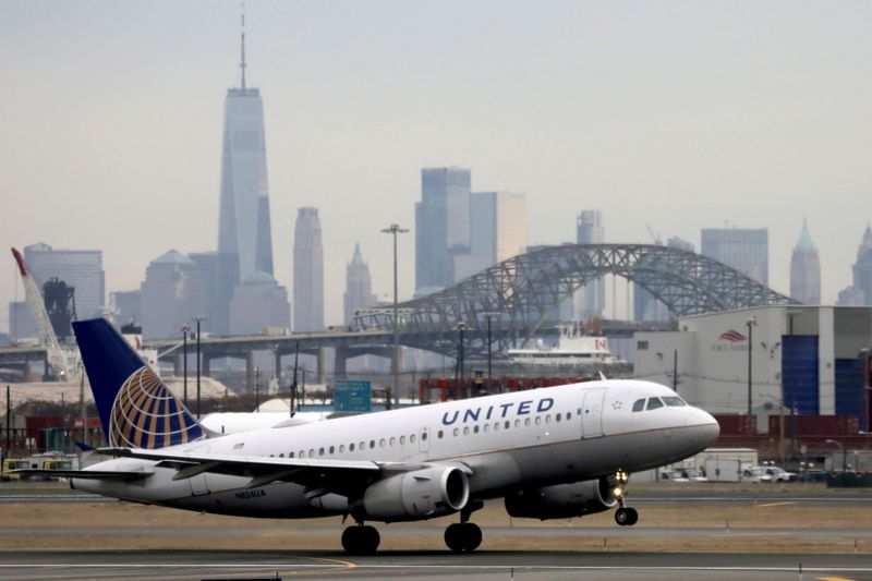 FILE PHOTO: A United Airlines passenger jet takes off with