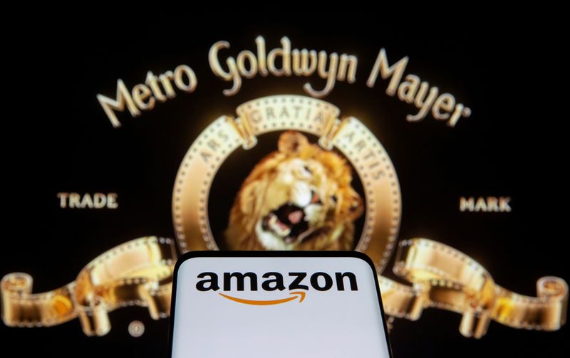 FILE PHOTO: Smartphone with Amazon logo is seen in front