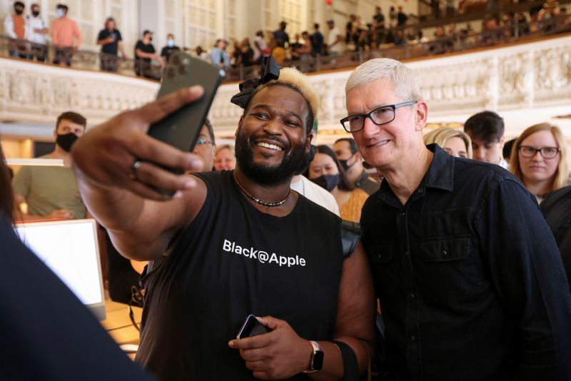 Apple CEO Tim Cook poses for a photo as he