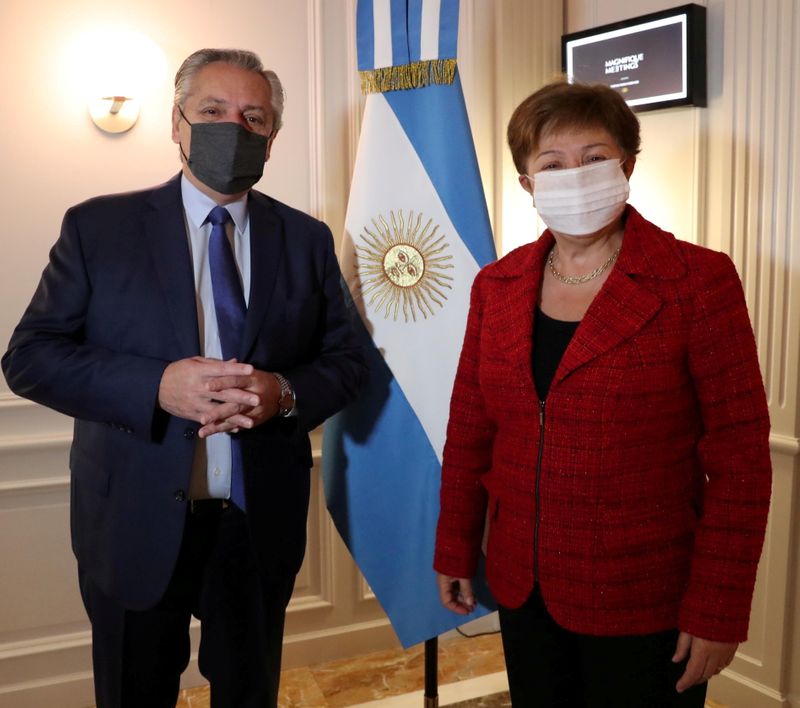 FILE PHOTO: Argentina’s President Alberto Fernandez poses next to International