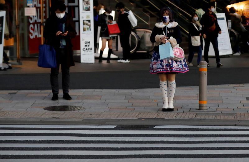Pedestrians wearing protective masks amid the coronavirus disease (COVID-19) outbreak