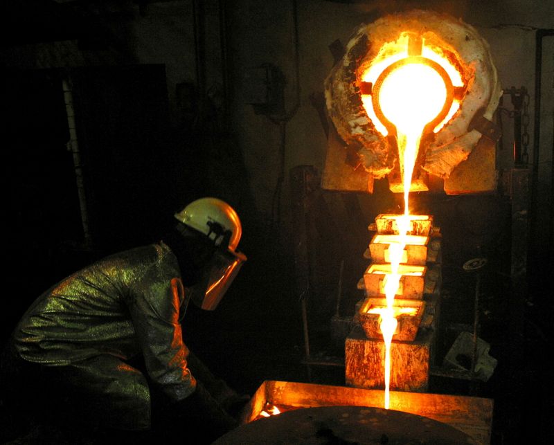 FILE PHOTO: A worker pours gold at the AngloGold Ashanti