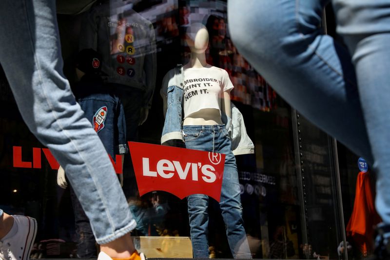 FILE PHOTO: People pass by a Levi Strauss store in